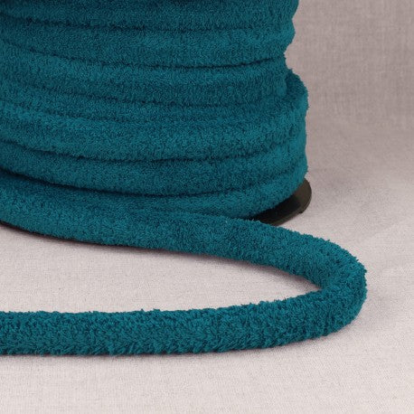 Teal polyester cord with loops for bags.