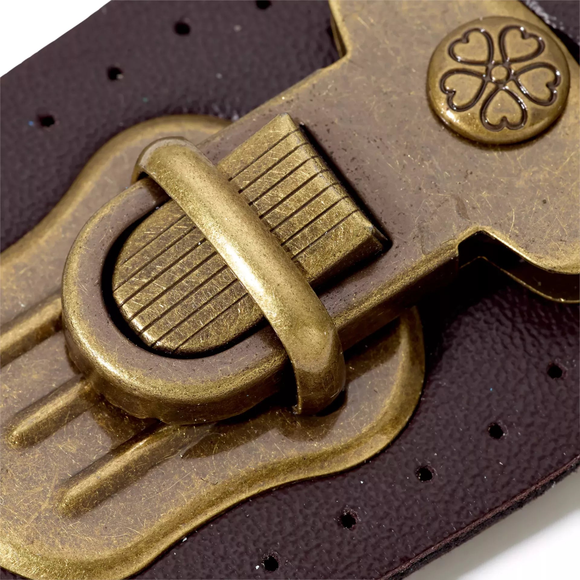 Prym tuck lock for sewing featuring brown imitation leather and antique brass metal hardware.