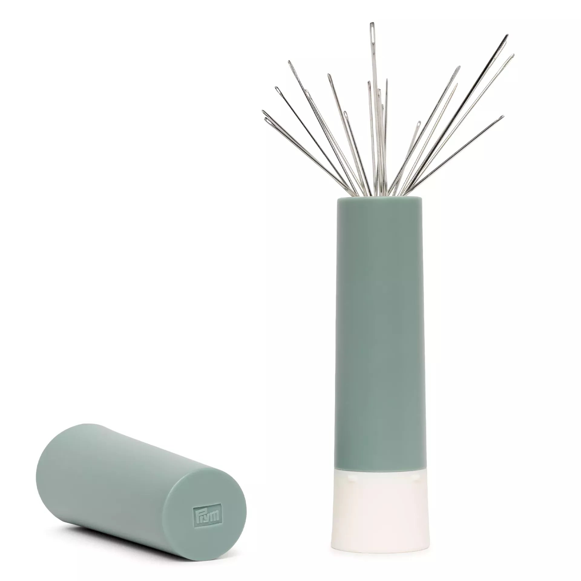 Prym sage green needle twister with 19 sewing and darning needles fanned out by a magnet.