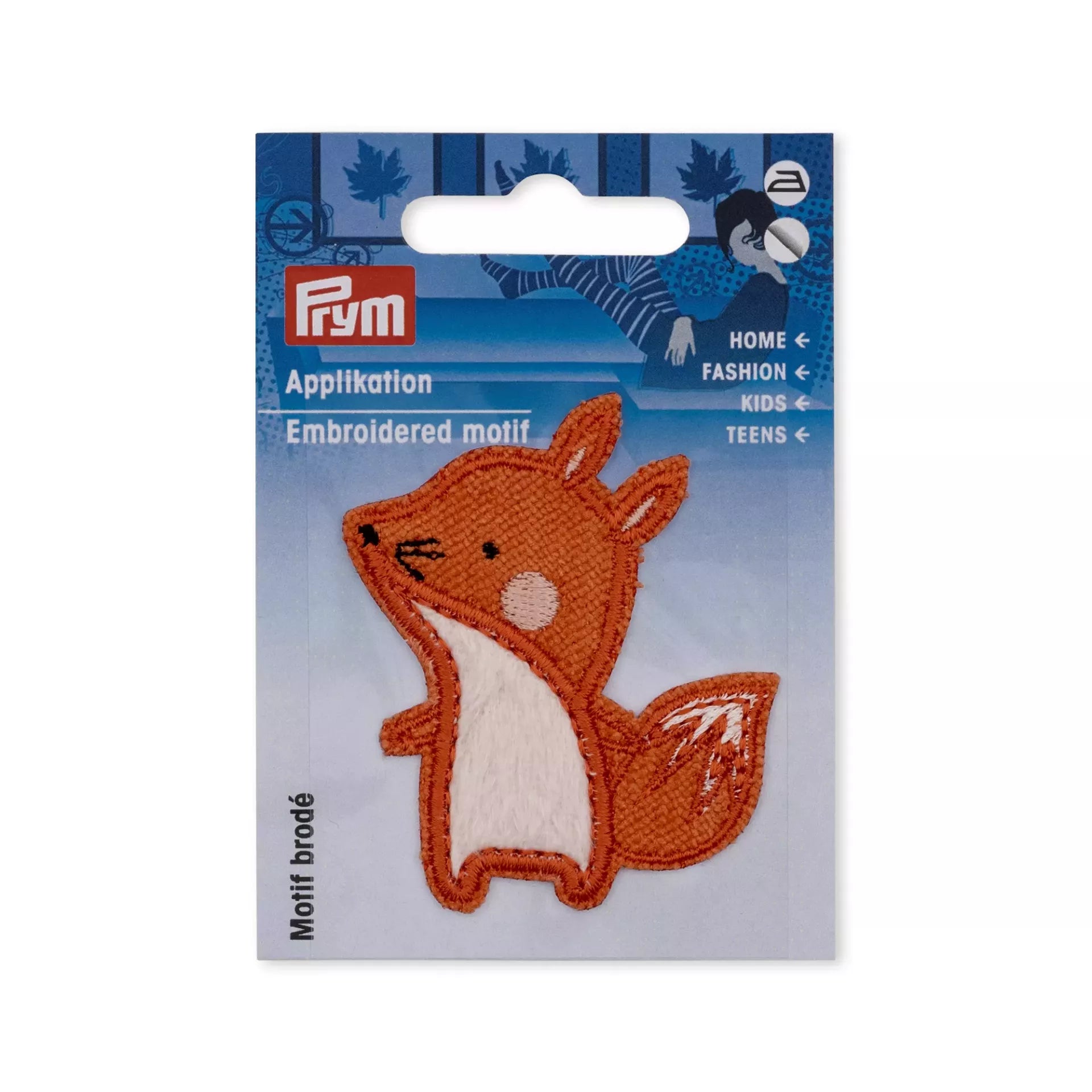 Embroidered iron-on fox applique in orange and white on its original blue Prym packaging.