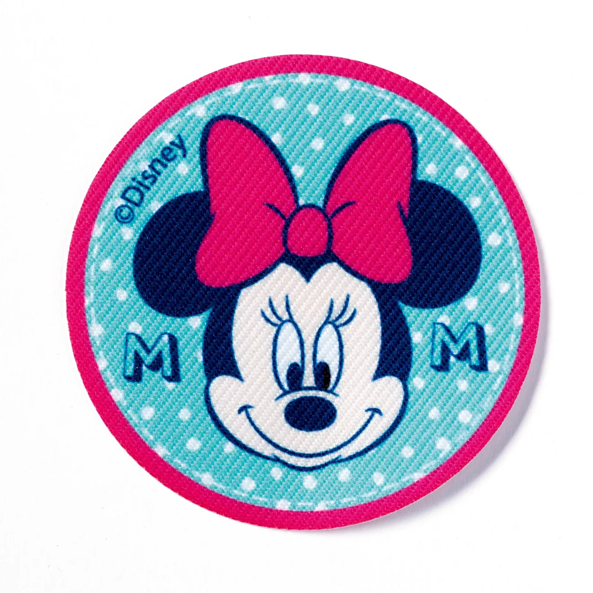 Round Minnie Mouse iron-on appliqué with a pink bow on a blue polka dot background.