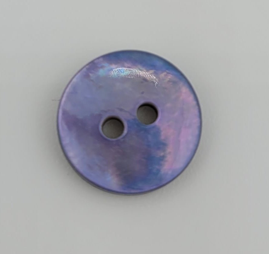 A 10mm iridescent purple shell button with two holes.