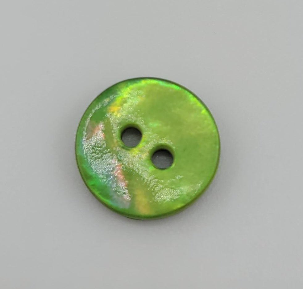 A 10mm iridescent green shell button with two holes.