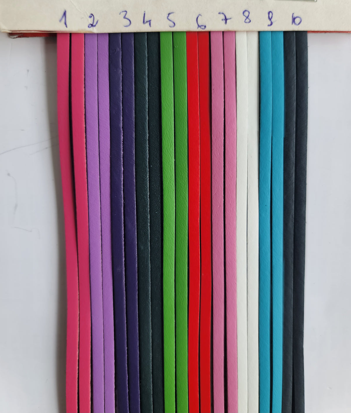 Ten 3mm wide leather straps in various colors, numbered 1 through 10.