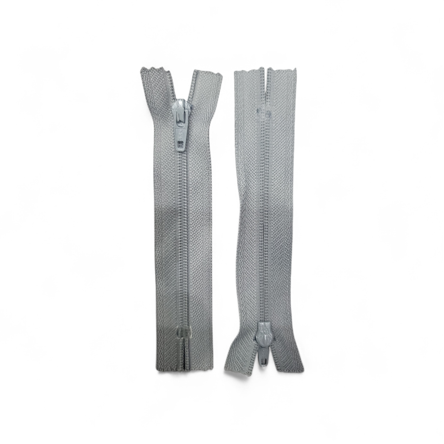 Two grey YKK 10cm closed-end plastic zippers on a white background.