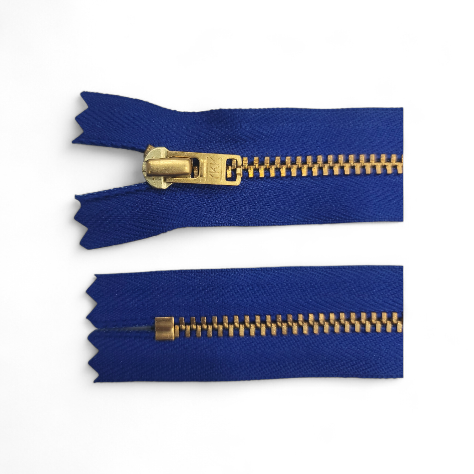 Two blue zippers with gold metal teeth and sliders on a white background.