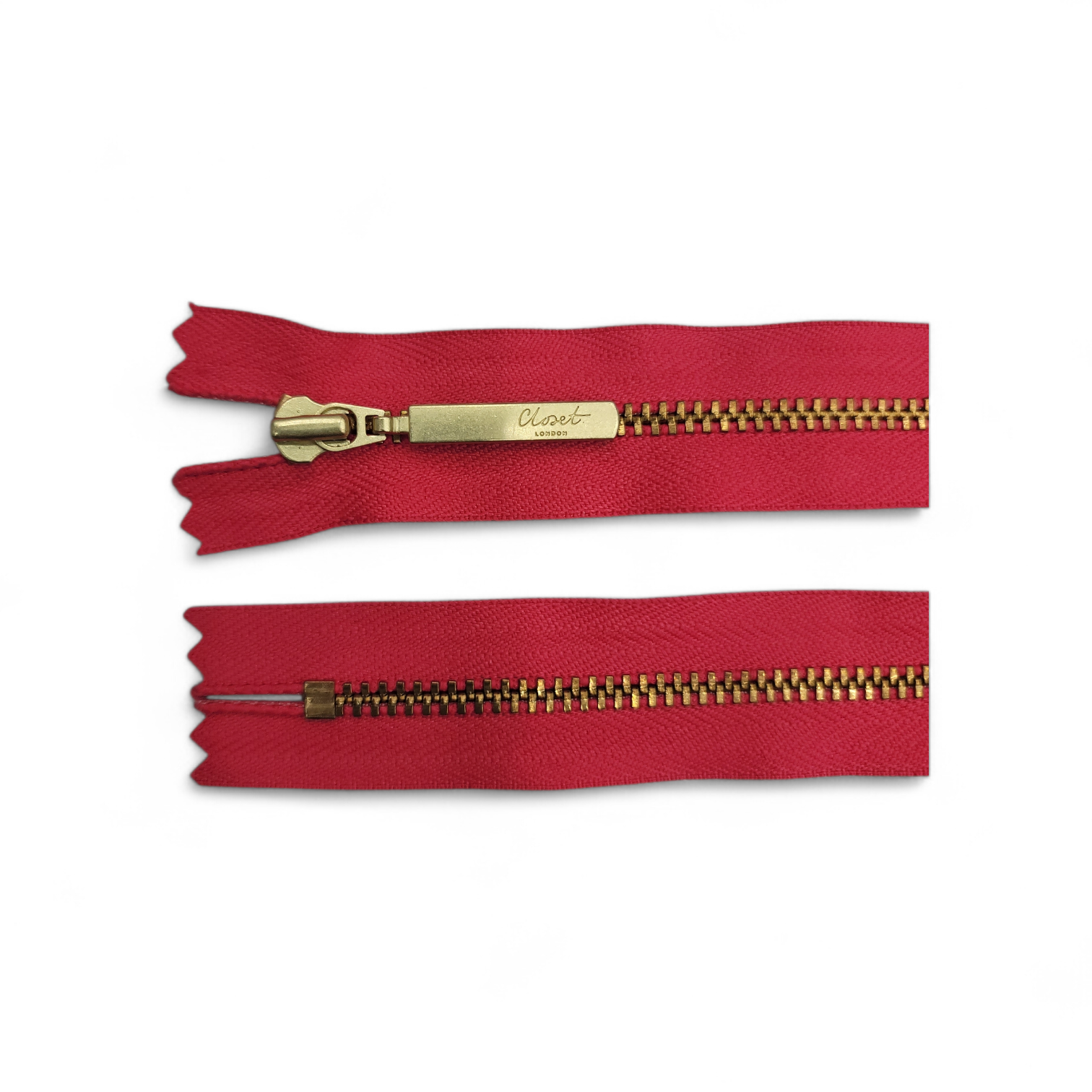 Red YKK closed-end zipper with gold metal teeth and pull.