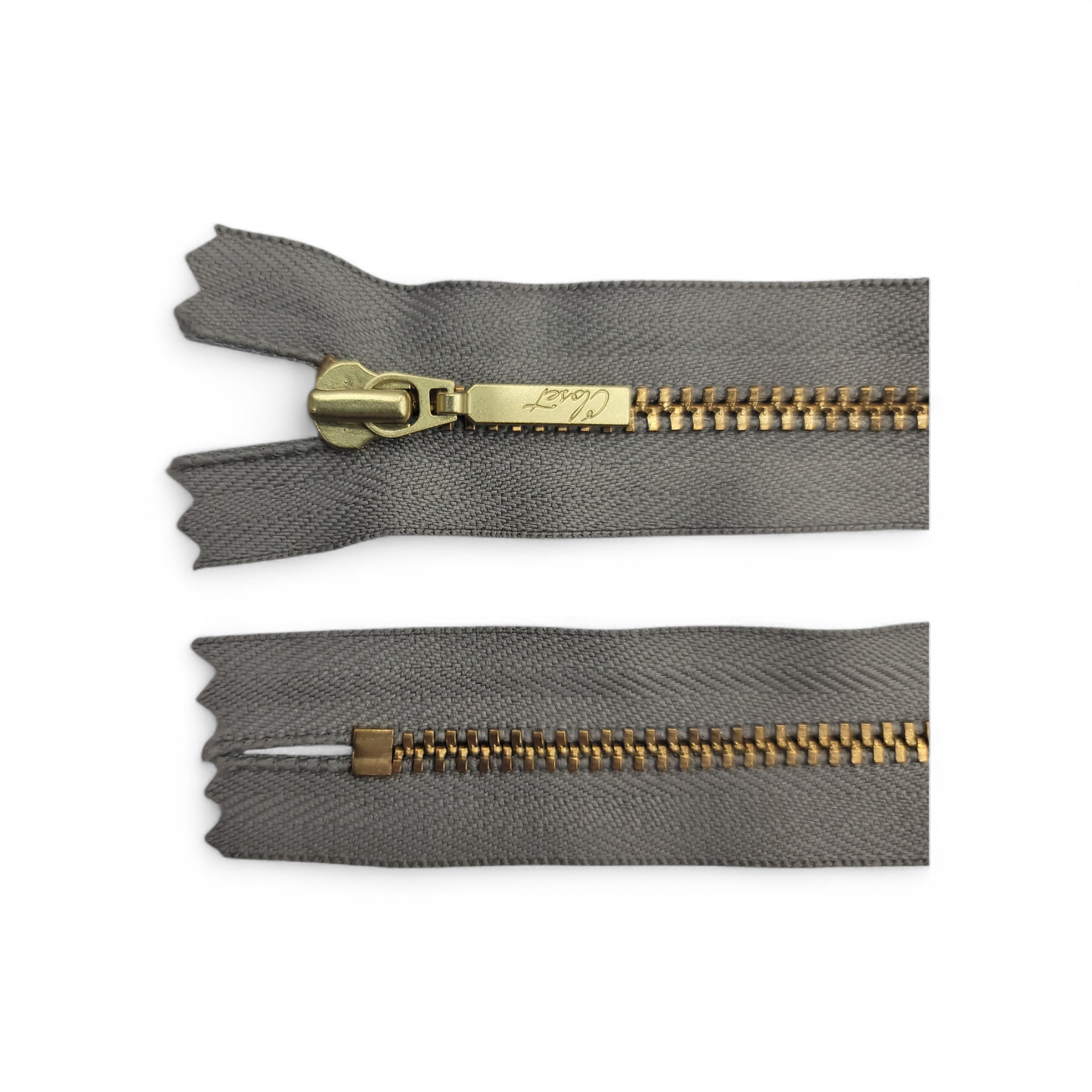 YKK size 3 closed end gold metal zip with grey fabric.