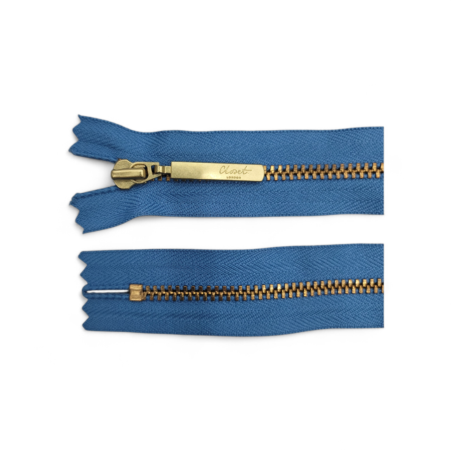 YKK Size 3 closed end gold metal zip with blue fabric.