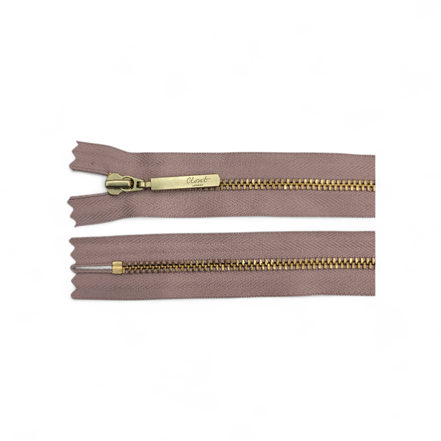 Two closed-end zippers with taupe fabric and gold metal teeth.