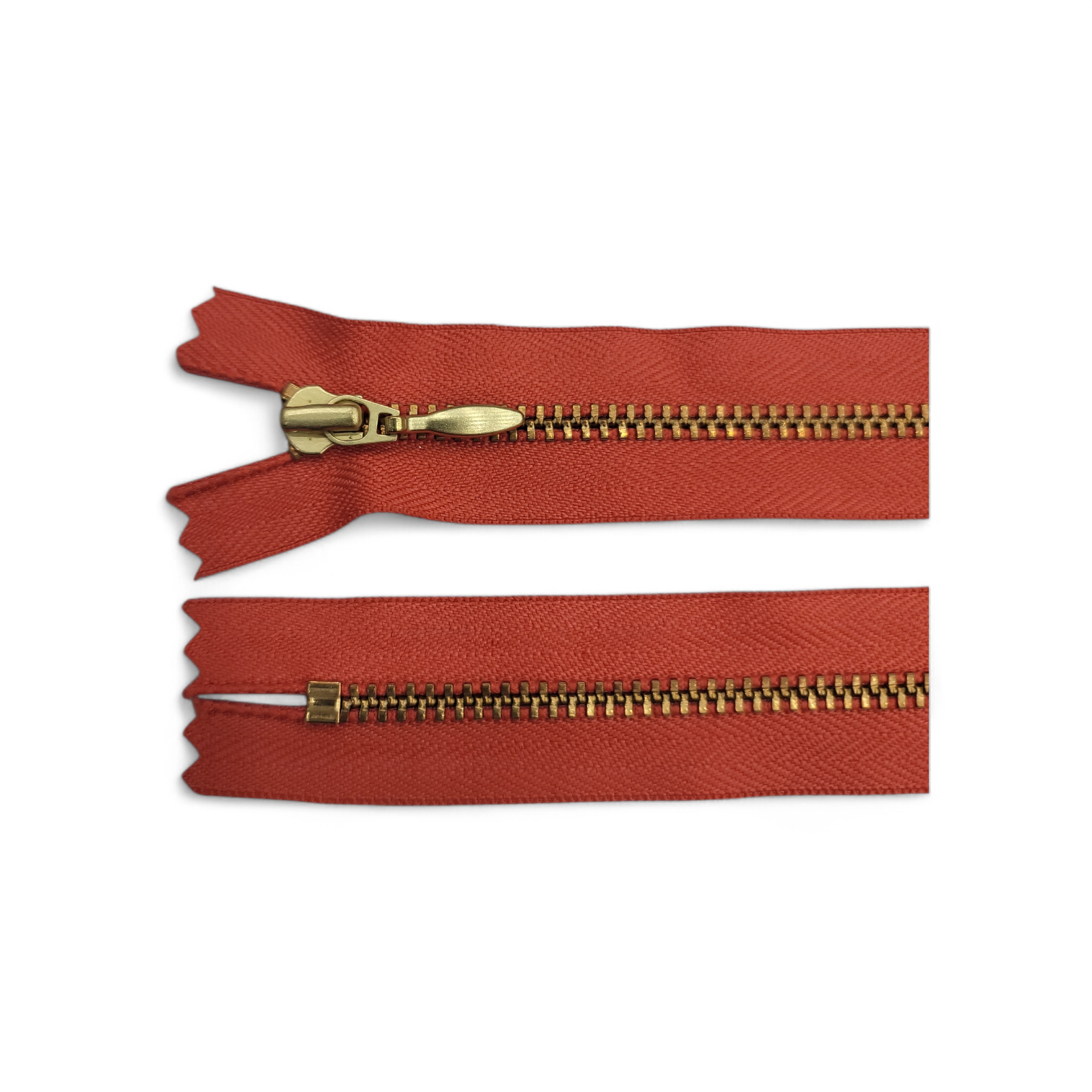 YKK Size 3 closed end gold metal zipper with red fabric.
