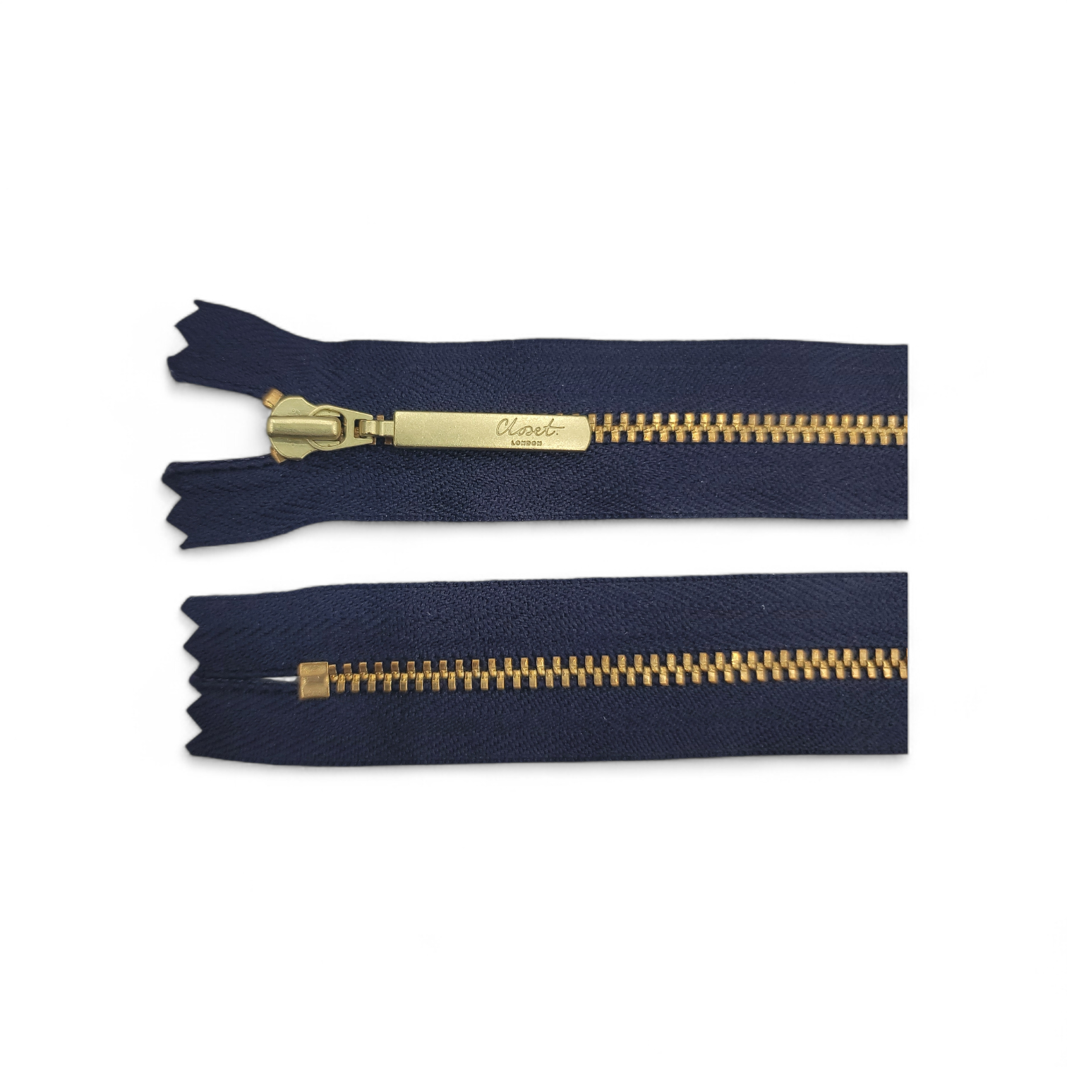 YKK size 3 closed end gold metal zip with navy tape.