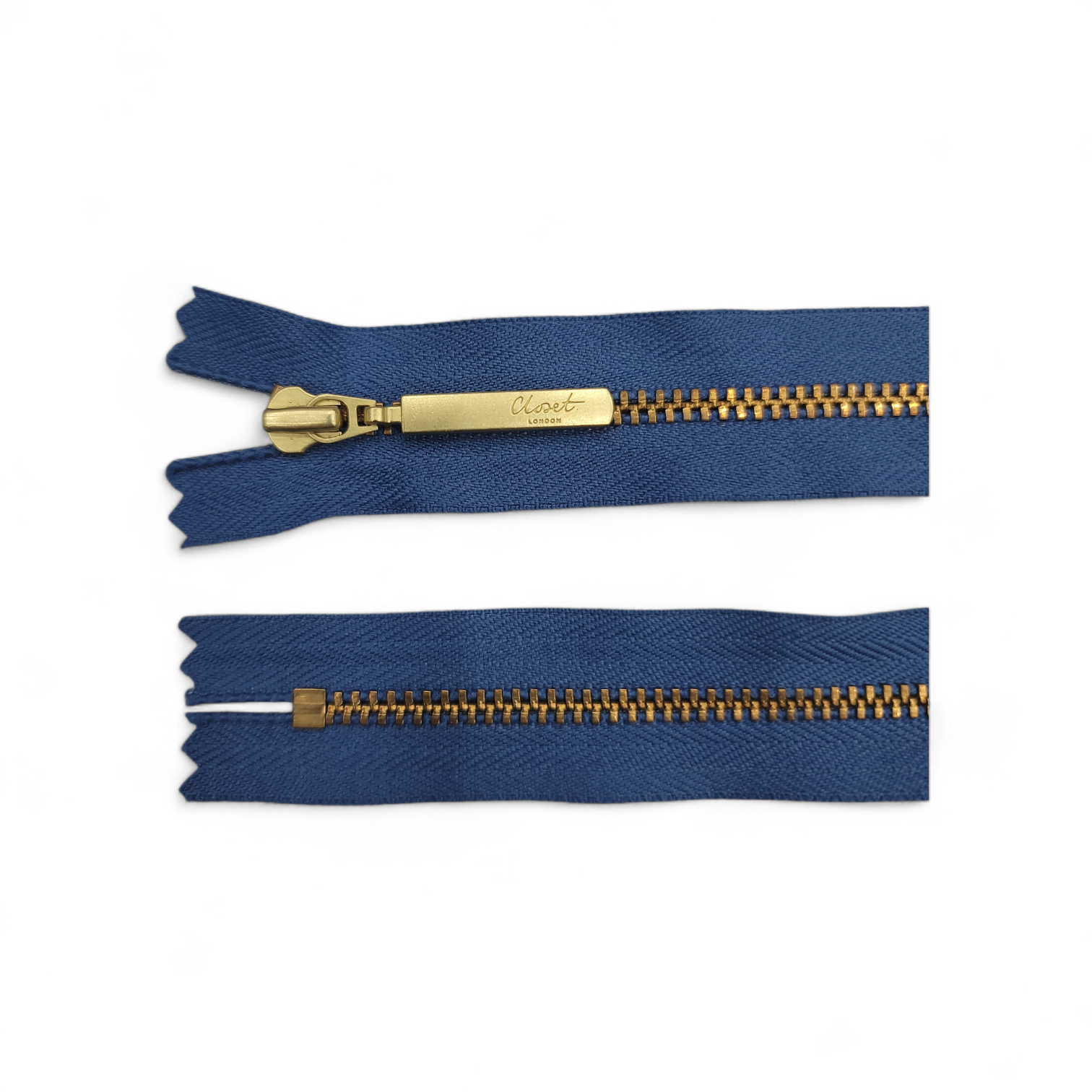 YKK size 3 closed end gold metal zip with navy fabric.