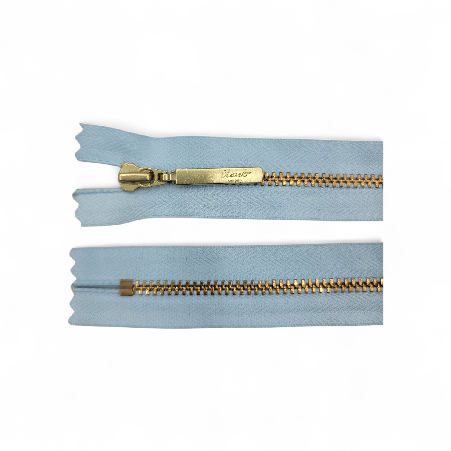 Light blue zipper with gold teeth and a gold pull tab.
