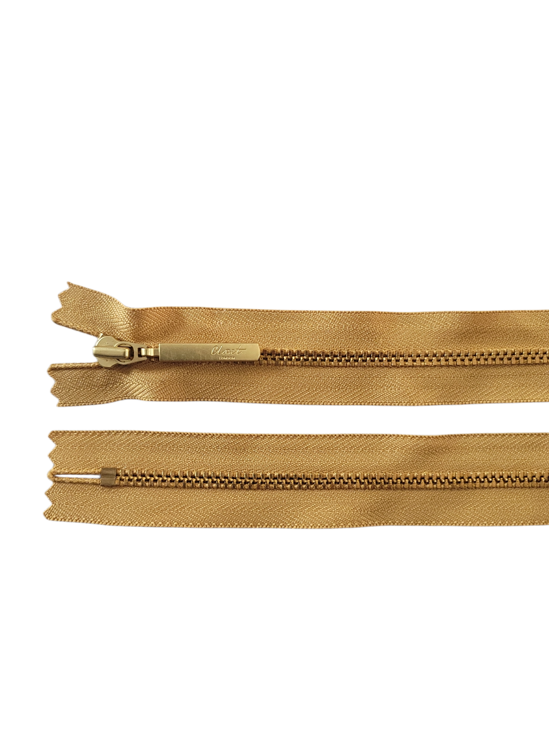 YKK Size 3 closed end gold metal zipper with a brass pull tab.