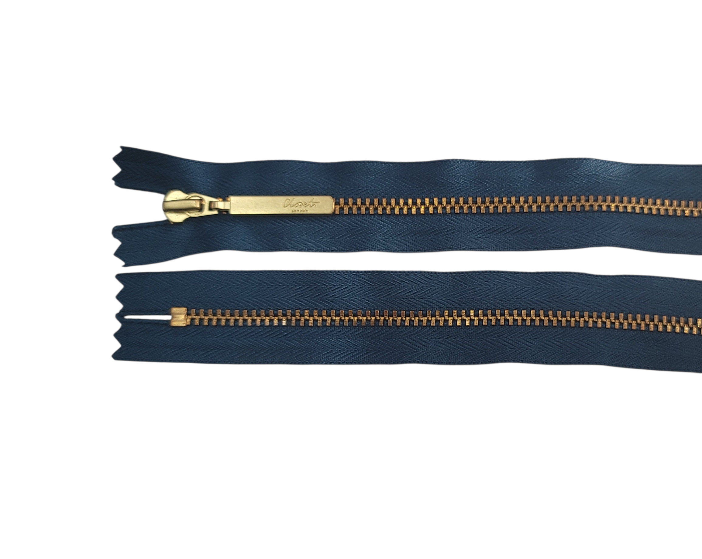 Two dark blue zippers with gold metal teeth and sliders, one with a branded slider.