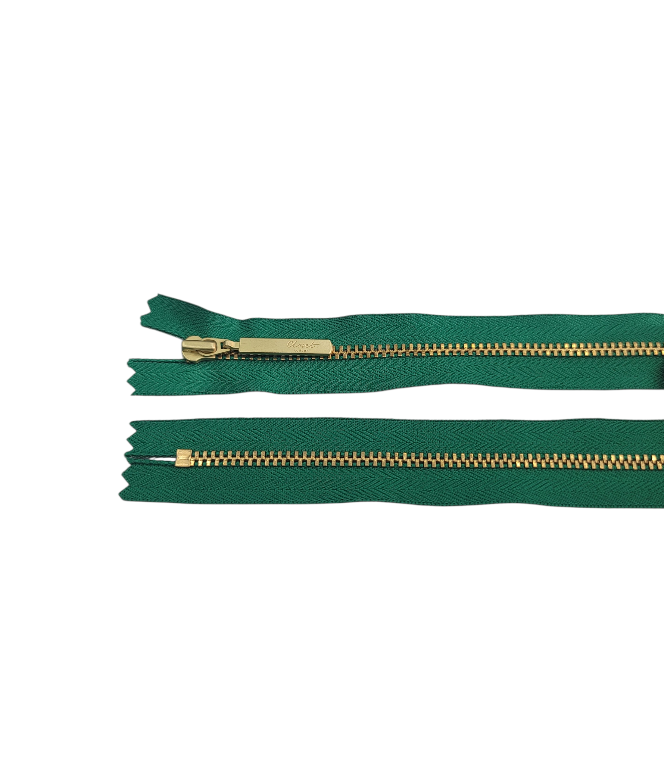 YKK Size 3 closed end gold metal zip with green tape.