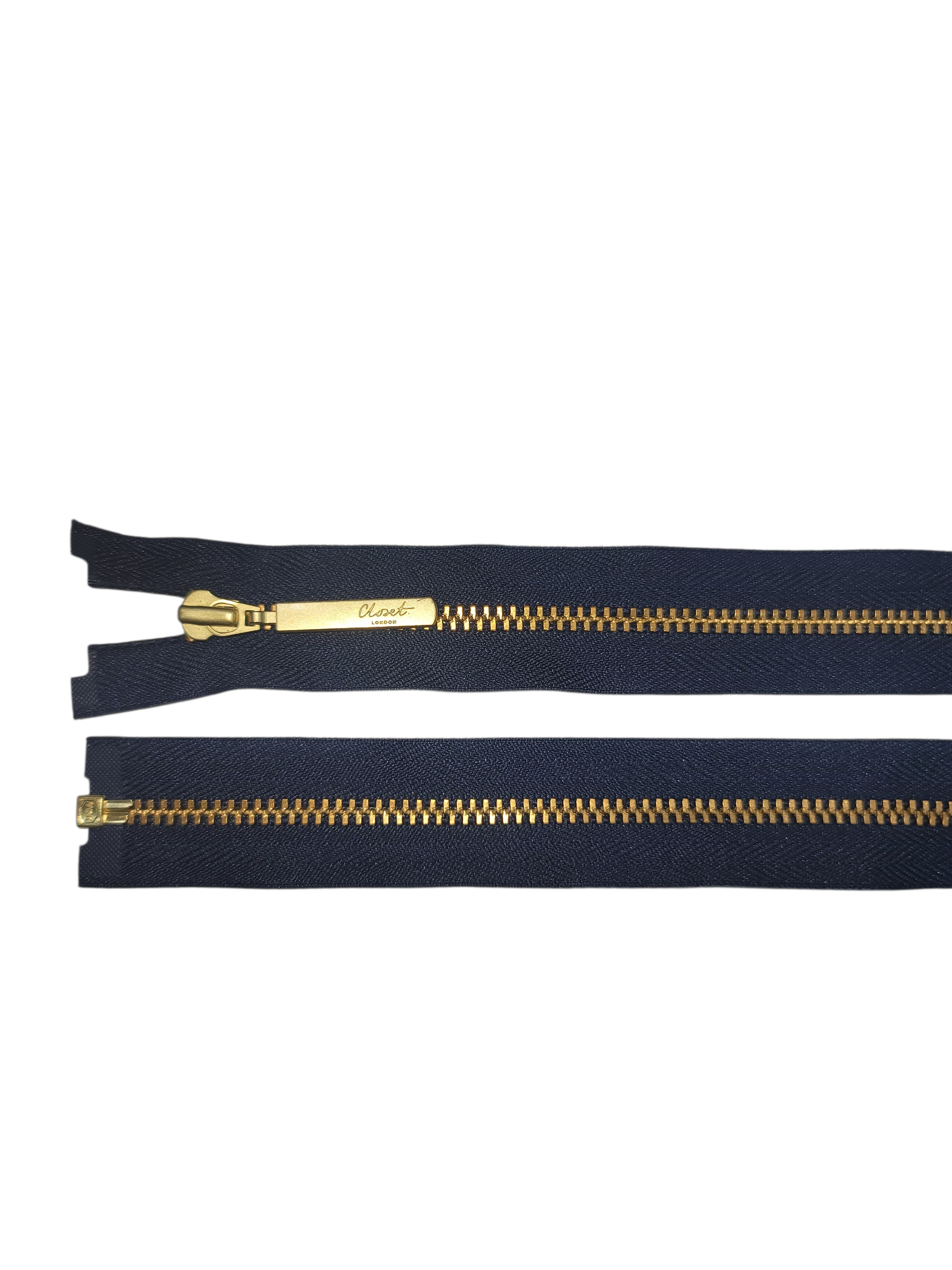 YKK size 3 open end gold metal zipper with navy tape.