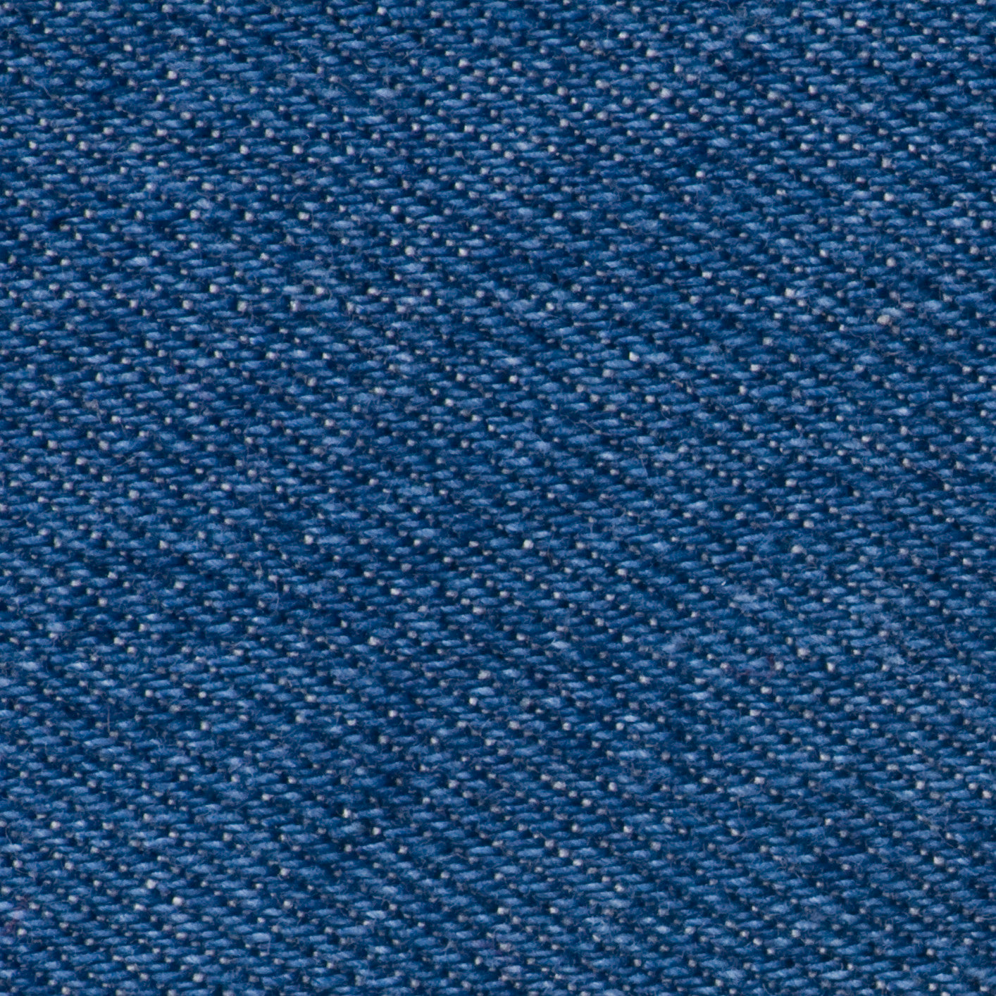 Blue denim fabric with a visible weave pattern.