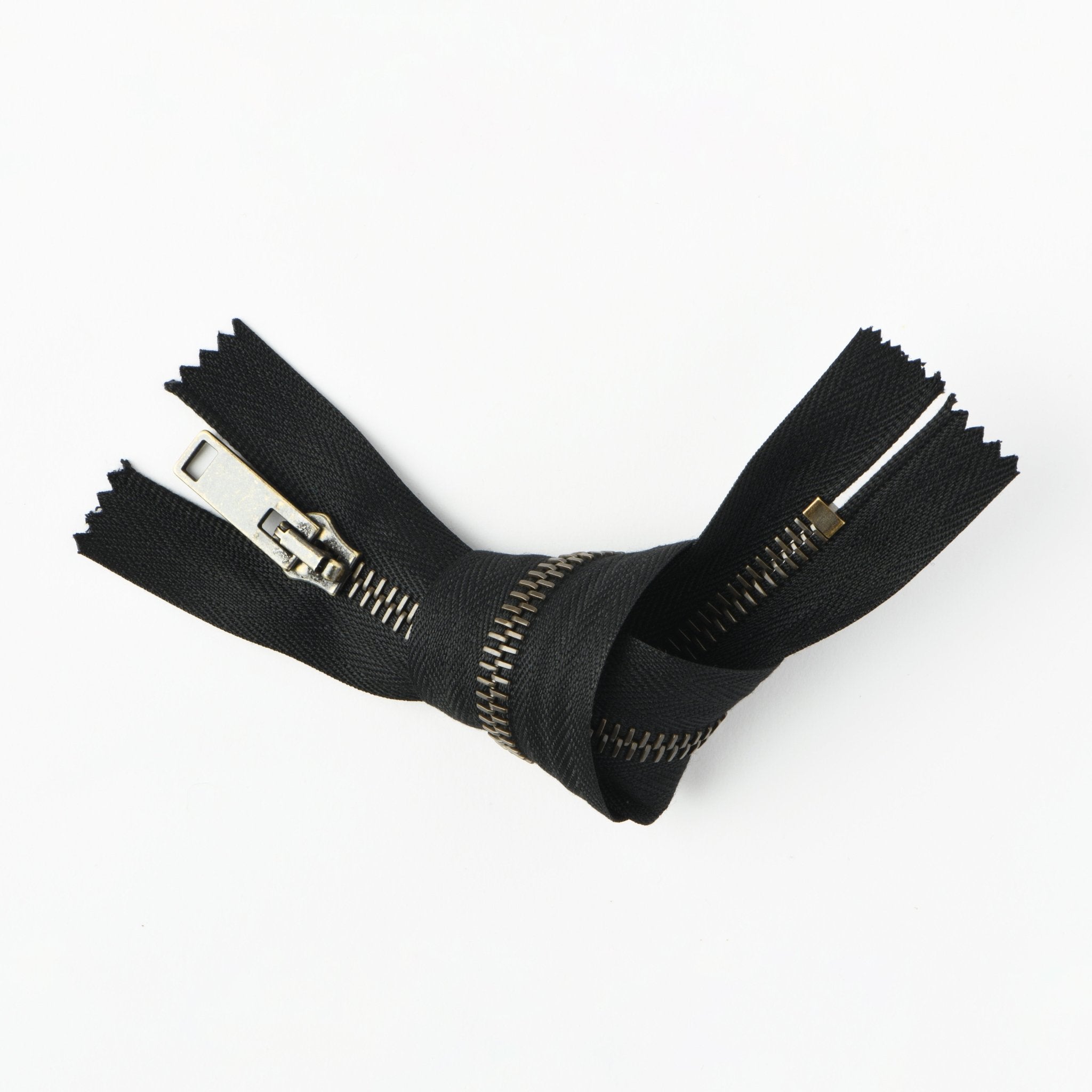 RIRI brass metal zipper with closed end fastener.