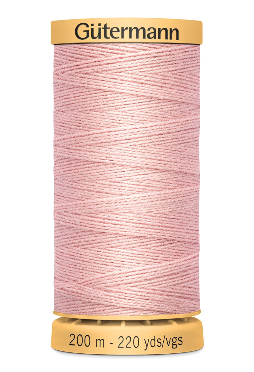 Gutermann pink cotton basting thread on a spool, 200m.