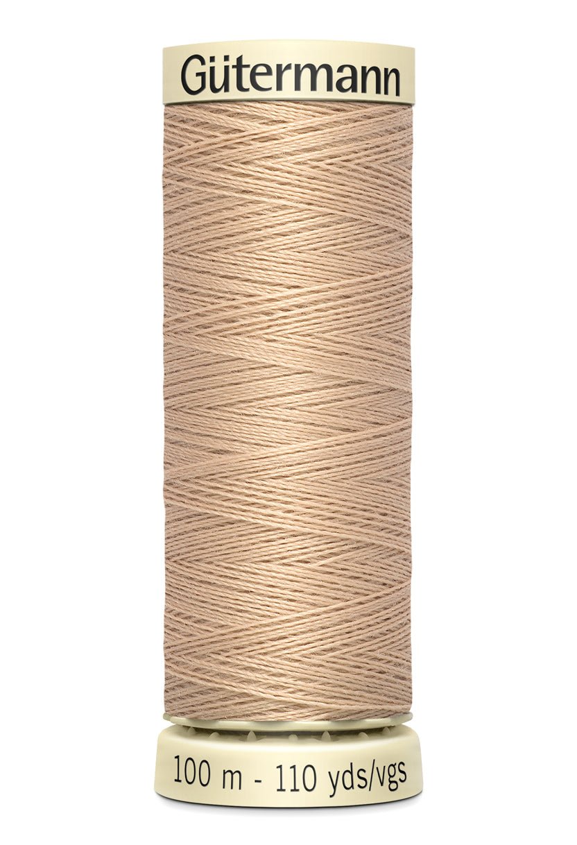Gutermann Sew-All thread, 100m spool of beige 100% polyester sewing thread.