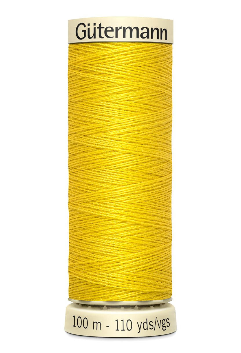 Gutermann yellow polyester sewing thread on a spool, 100m.