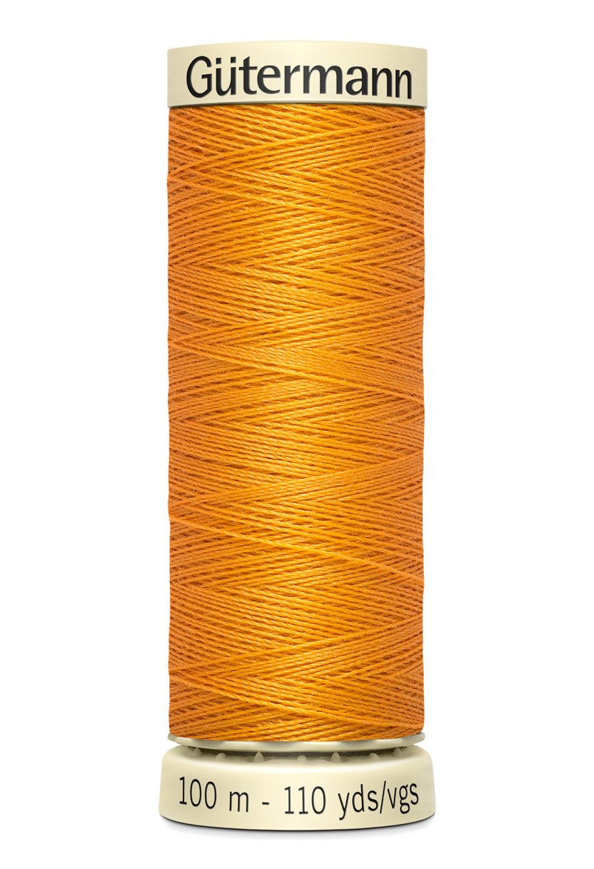 Gutermann Sew-All thread, 100m spool of orange 100% polyester thread.