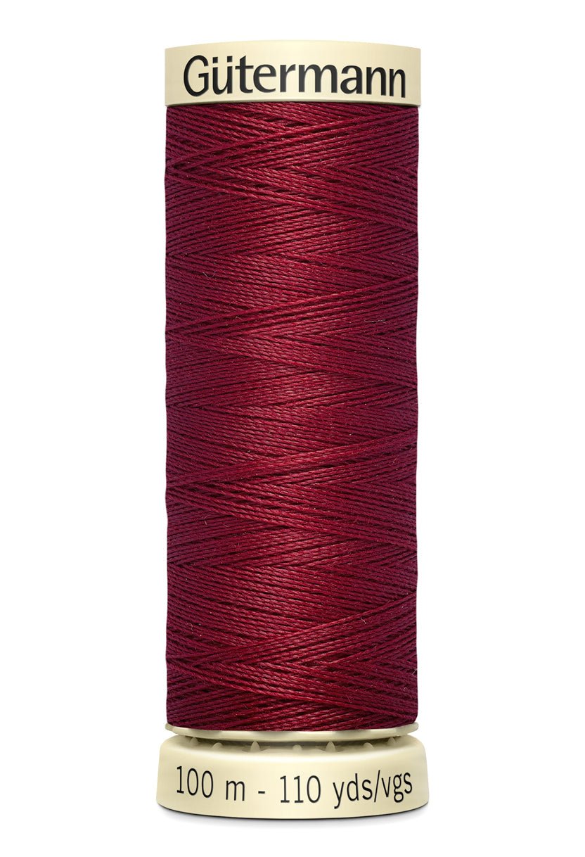 Gütermann Sew-All thread in dark red on a 100m spool.