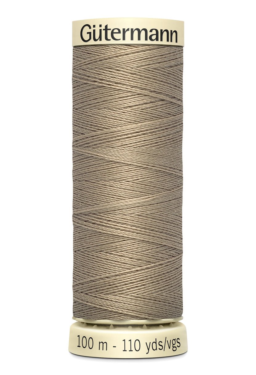 Gutermann Sew-All thread, 100m spool of beige 100% polyester sewing thread.