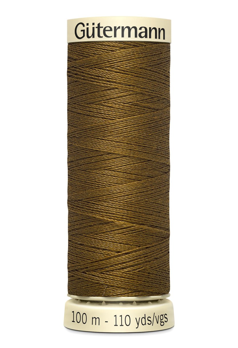 Gutermann Sew-All thread in a medium brown color on a spool.