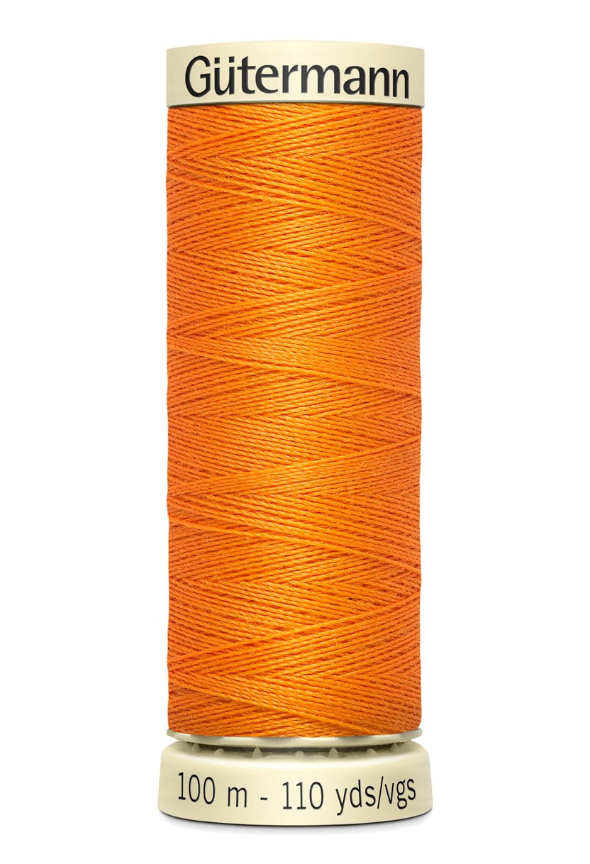 Gutermann orange polyester sewing thread on a spool, 100m.