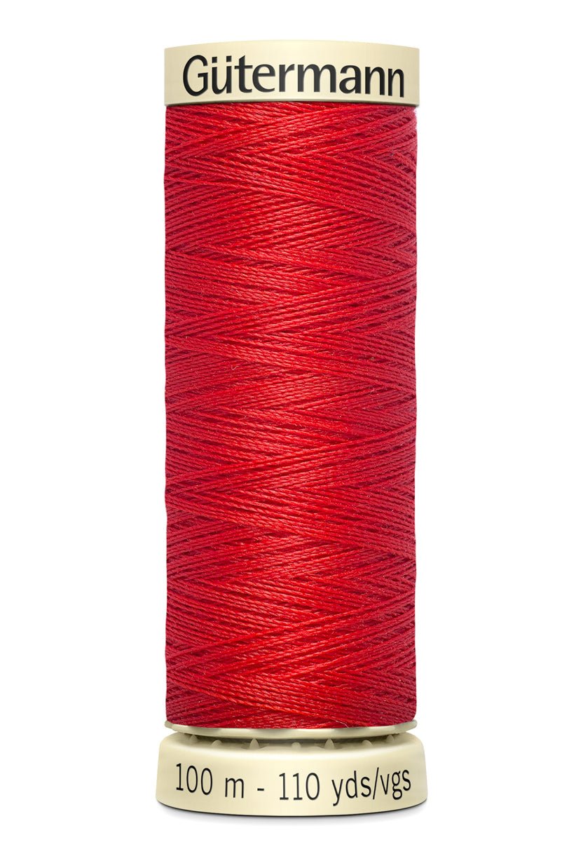 Gütermann red polyester sewing thread on a 100m spool.