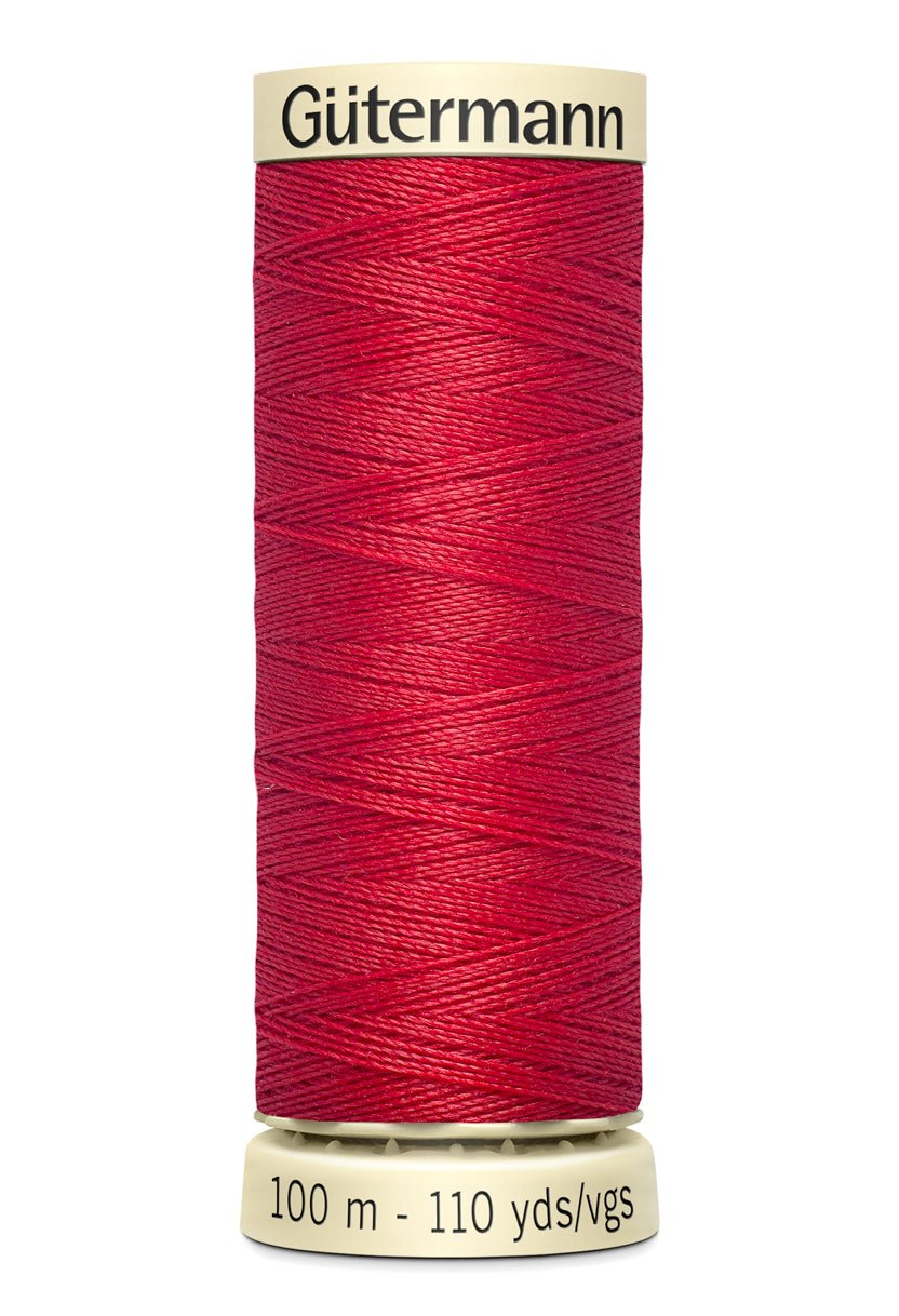 Gütermann red polyester sewing thread on a 100m spool.