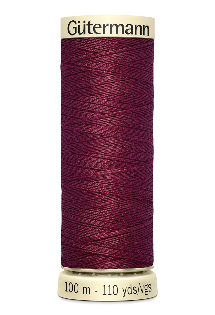 Gütermann Sew-All thread, 100m spool, dark red polyester.