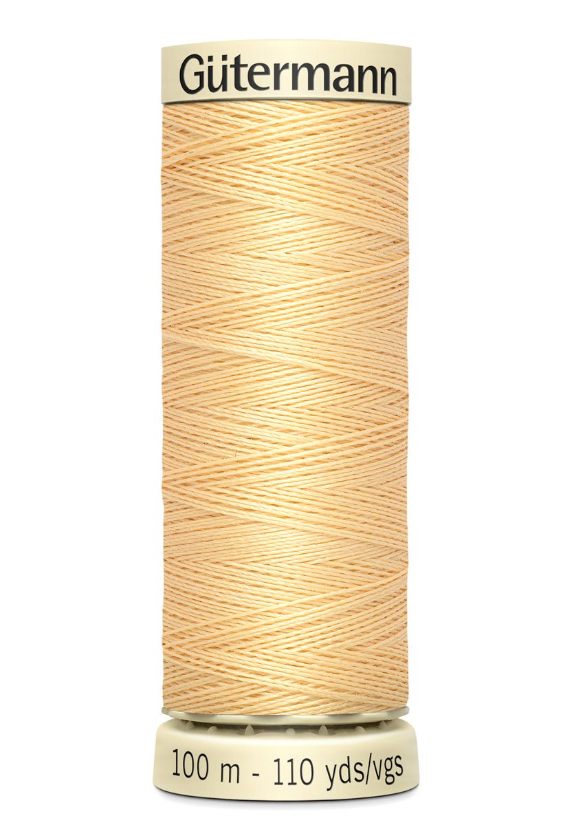 Gutermann Sew-All thread, 100m spool of light yellow polyester thread.