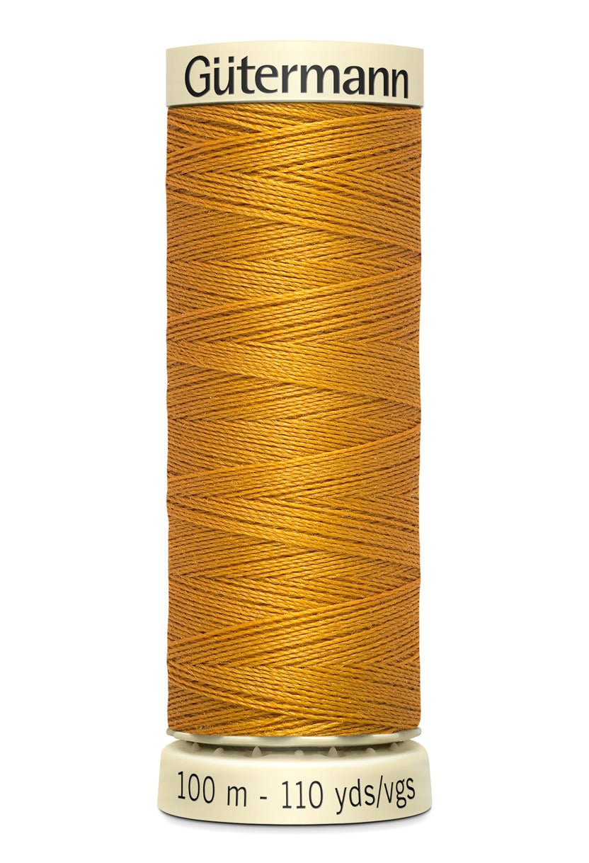 Gutermann Sew-All thread in a golden yellow color, 100m spool.