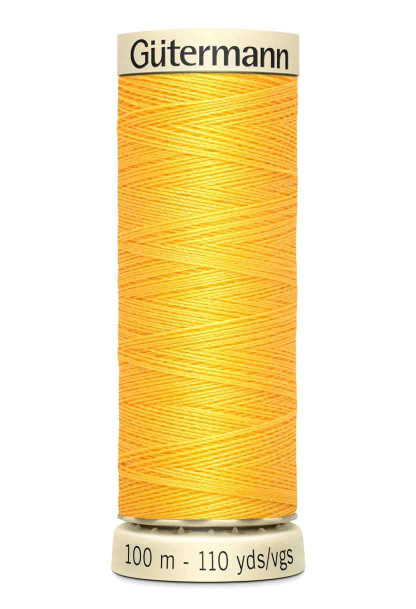 Gutermann Sew-All thread, 100m spool of yellow polyester thread.
