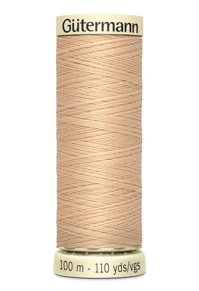 Gutermann Sew-All thread, 100m spool of beige 100% polyester sewing thread.