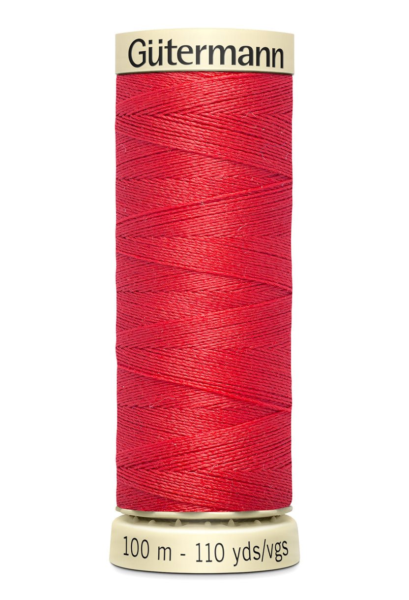 Gütermann red polyester sewing thread on a 100m spool.