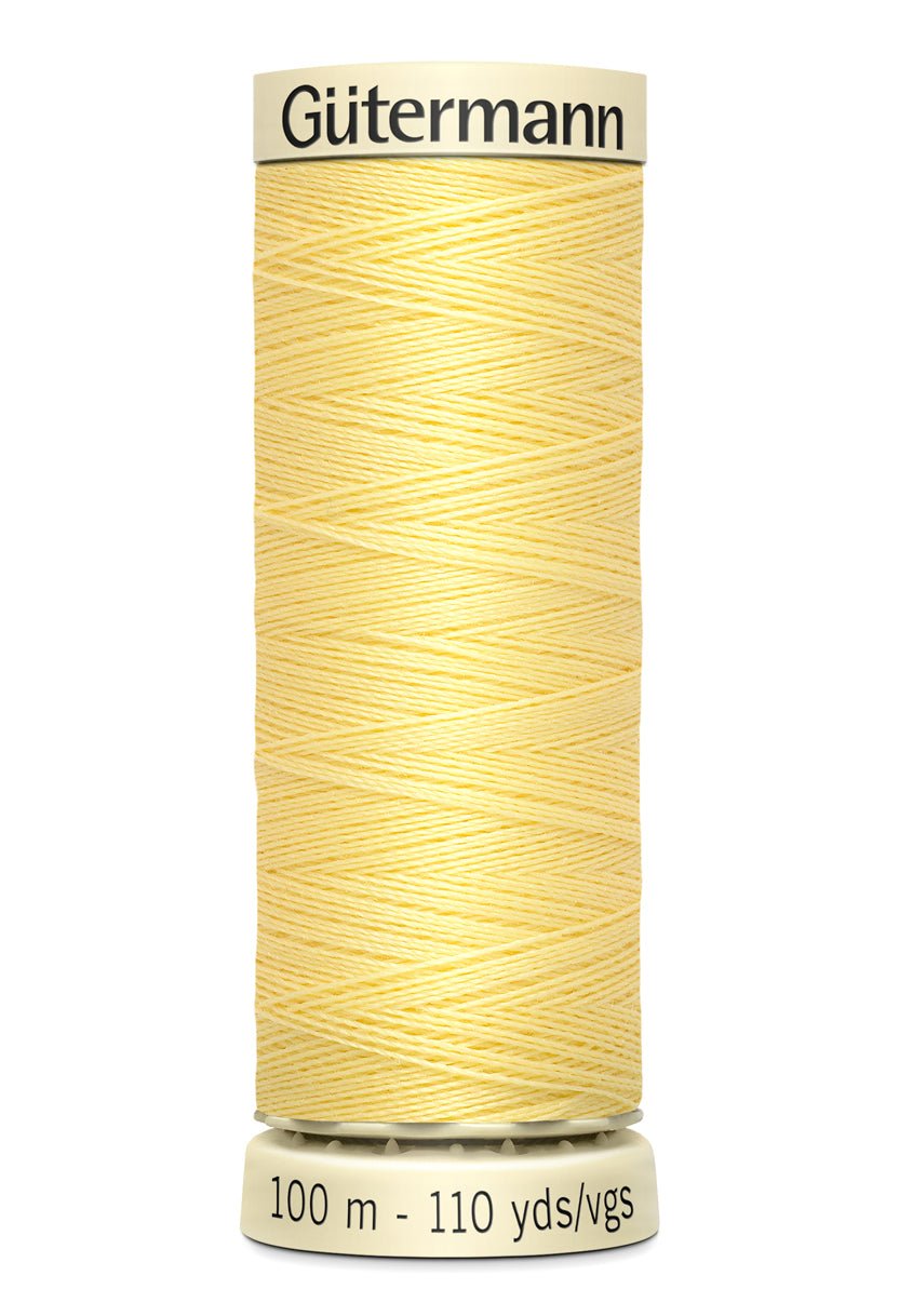 Gutermann Sew-All thread, 100m spool of light yellow polyester thread.