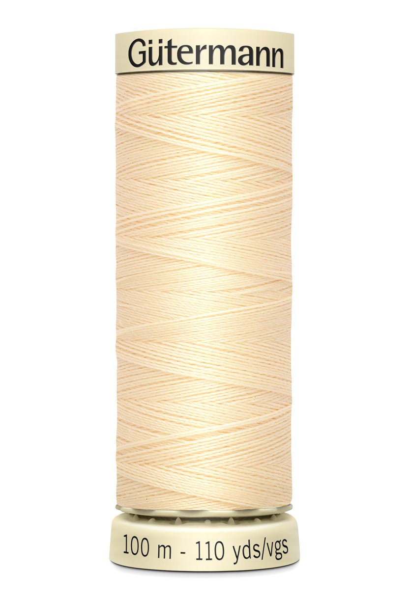 Gutermann Sew-All thread, 100m spool of light beige 100% polyester thread.