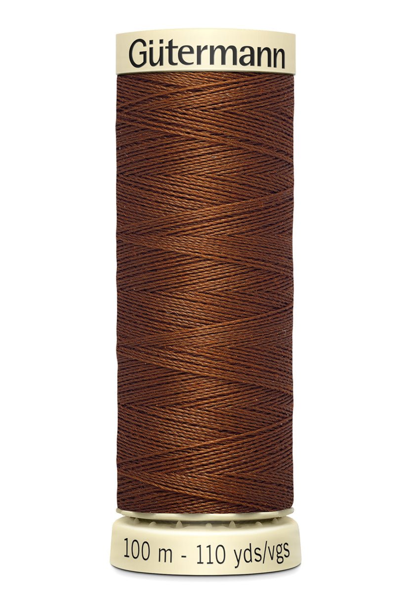 Gutermann Sew-All thread, 100m spool of brown 100% polyester thread.