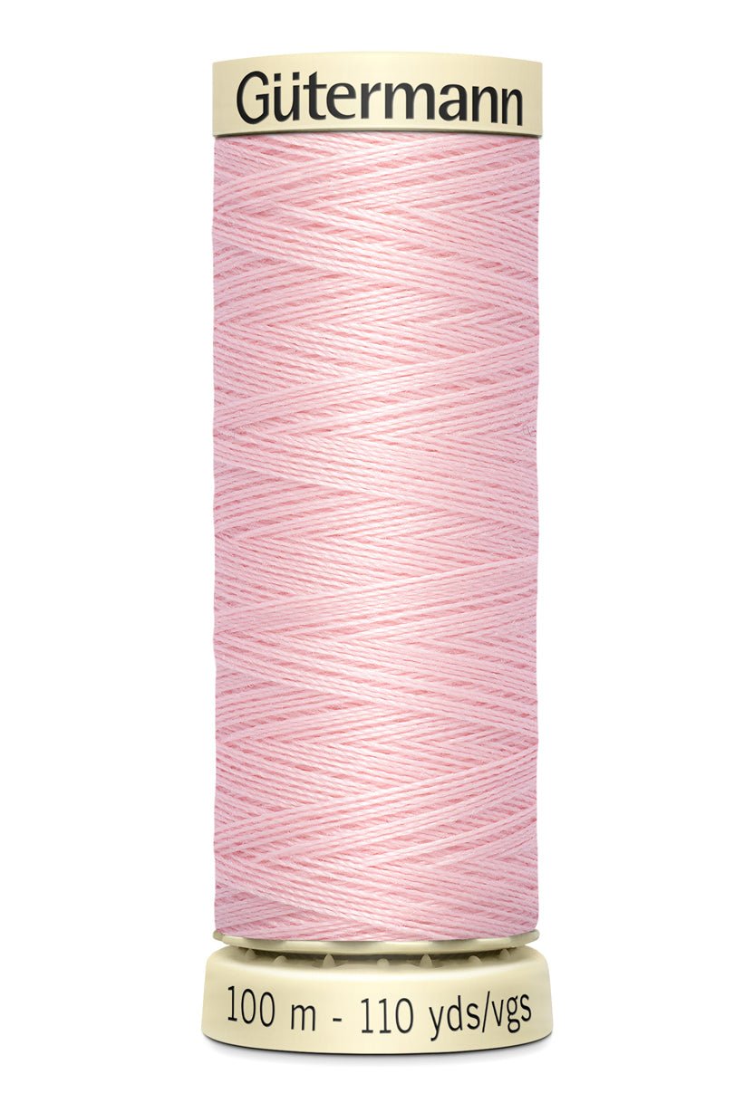 Gütermann Sew-All thread, 100m spool, light pink polyester.
