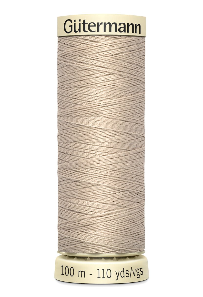 Gutermann Sew-All thread, 100m spool of beige 100% polyester thread.