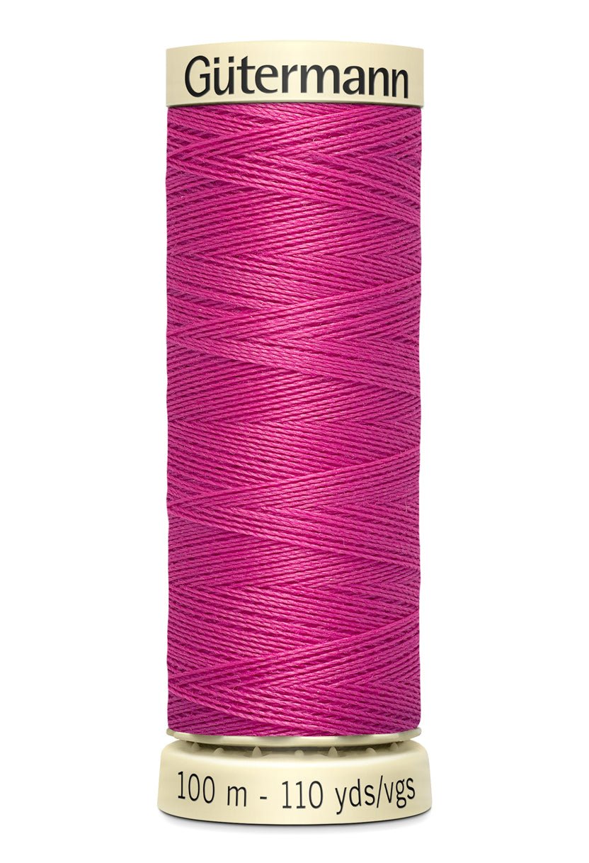 Gütermann Sew-All thread in magenta on a 100m spool.