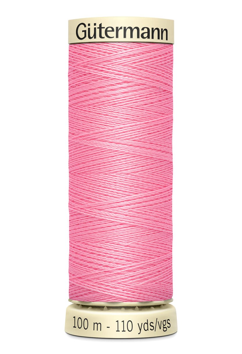 Gütermann pink polyester sewing thread on a 100m spool.