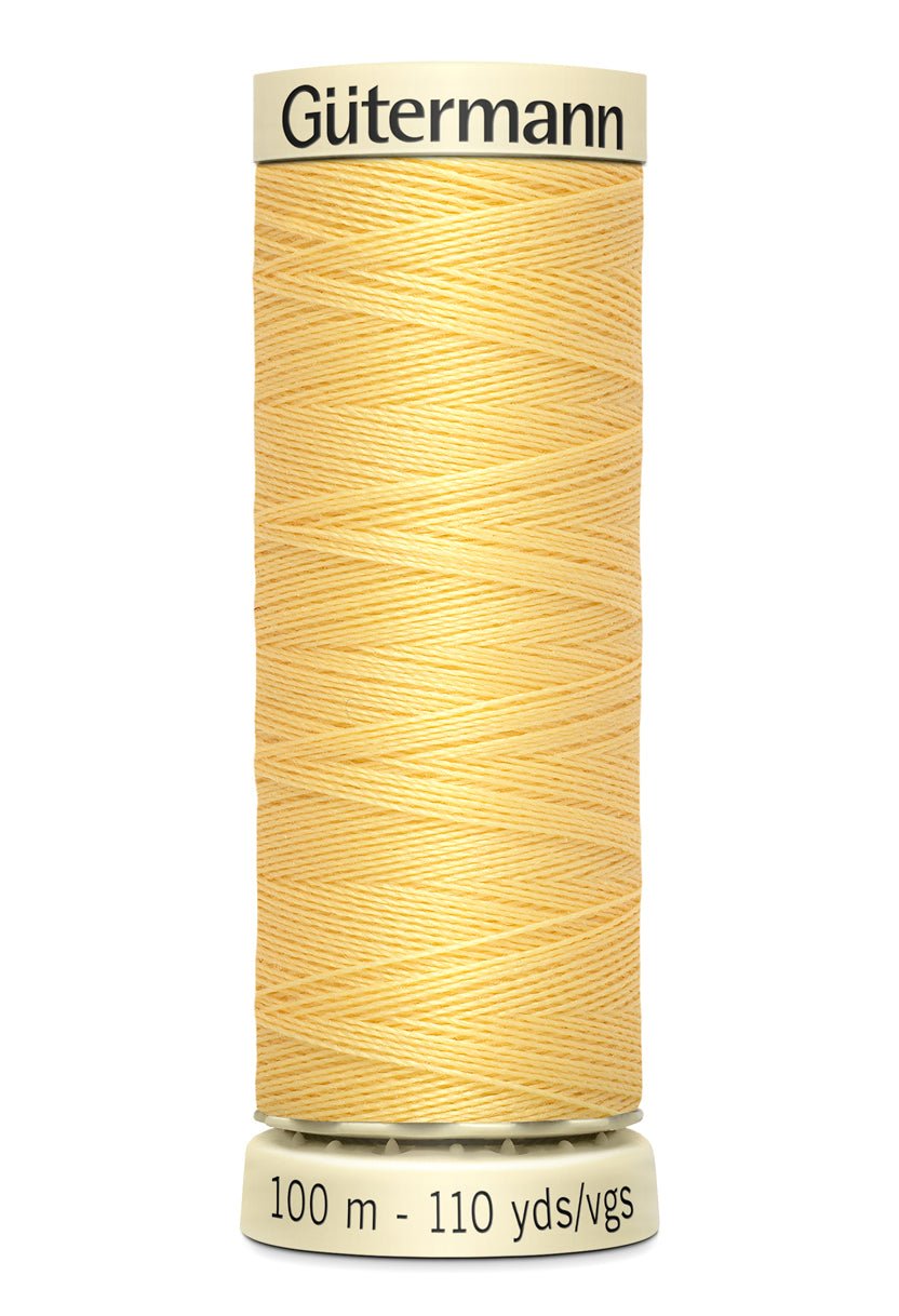 Gutermann Sew-All thread in light yellow, 100m spool.
