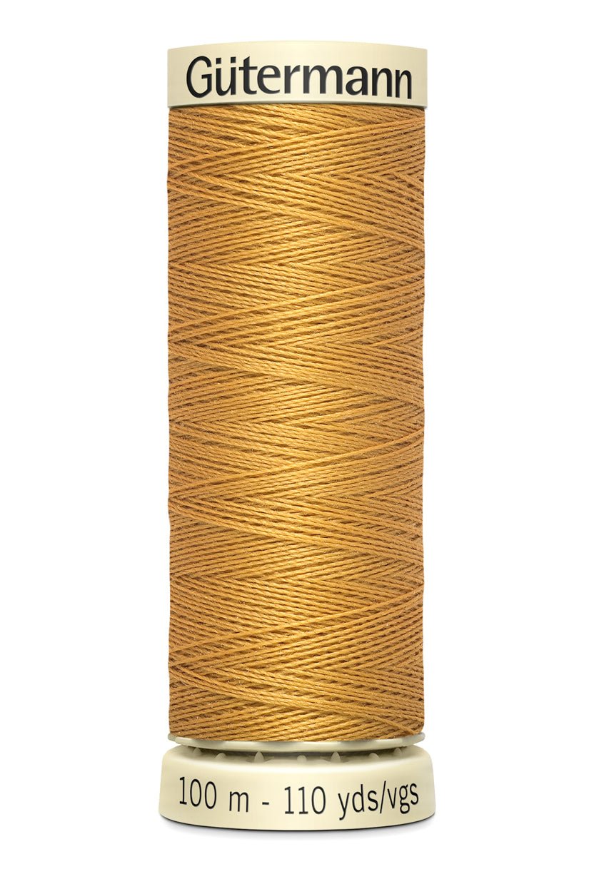 Gutermann Sew-All thread, 100m spool of golden-brown polyester thread.