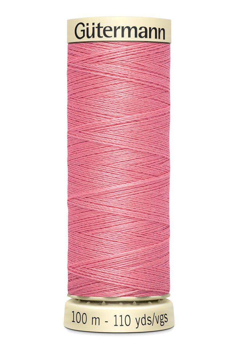 Gütermann pink polyester sewing thread on a 100m spool.